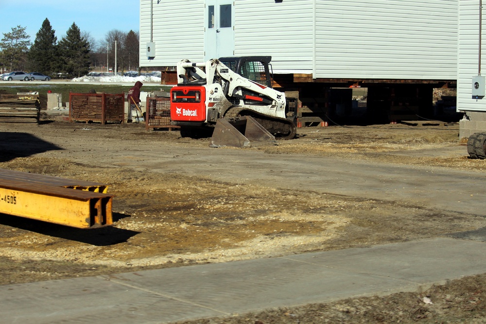 Contractors prepare World War II-era barracks buildings to be moved at Fort McCoy