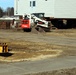 Contractors prepare World War II-era barracks buildings to be moved at Fort McCoy