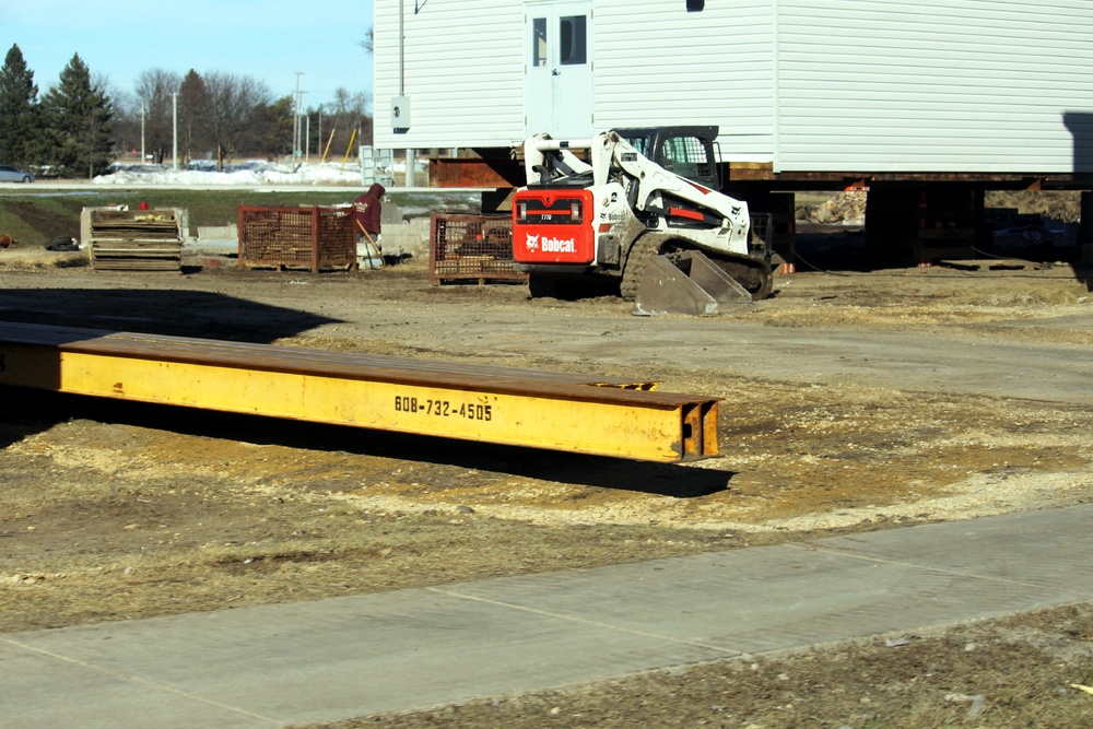 Contractors prepare World War II-era barracks buildings to be moved at Fort McCoy