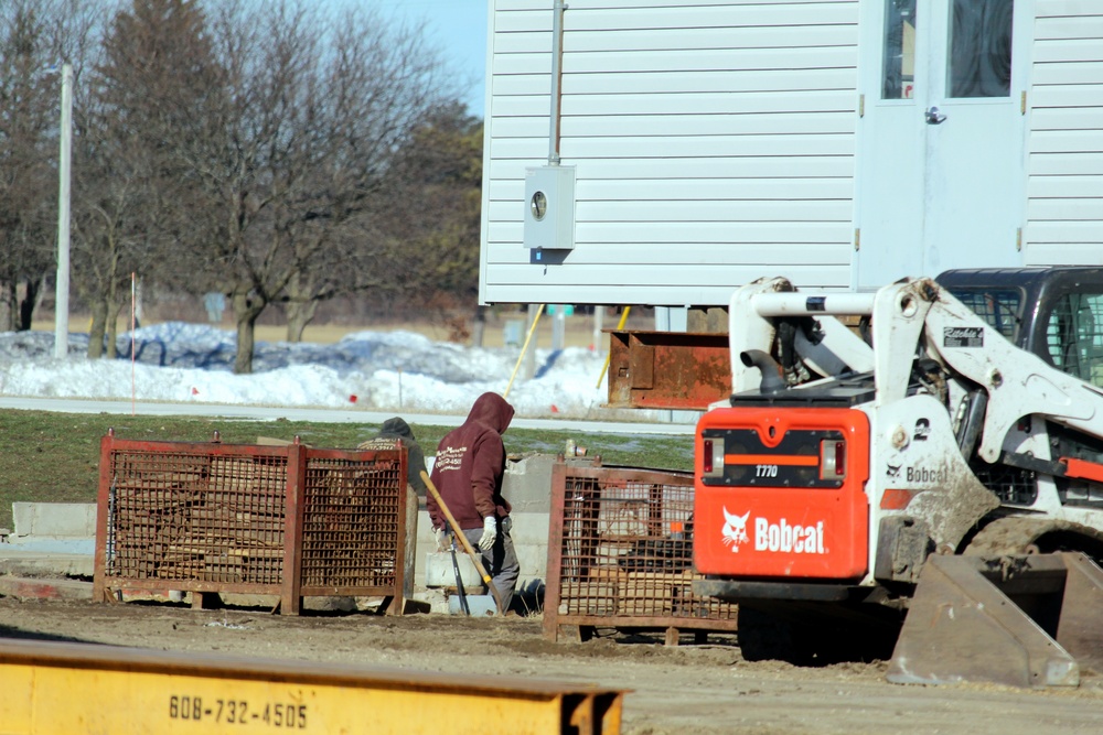 Contractors prepare World War II-era barracks buildings to be moved at Fort McCoy