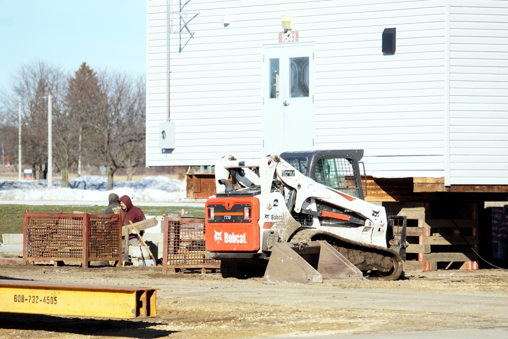 Contractors prepare World War II-era barracks buildings to be moved at Fort McCoy