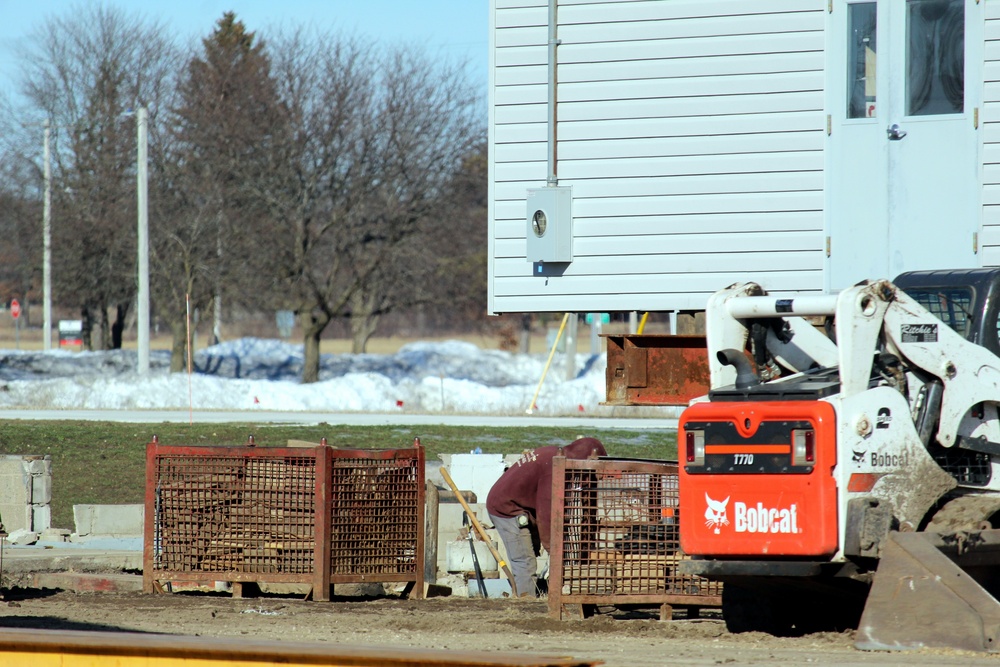 Contractors prepare World War II-era barracks buildings to be moved at Fort McCoy