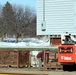 Contractors prepare World War II-era barracks buildings to be moved at Fort McCoy