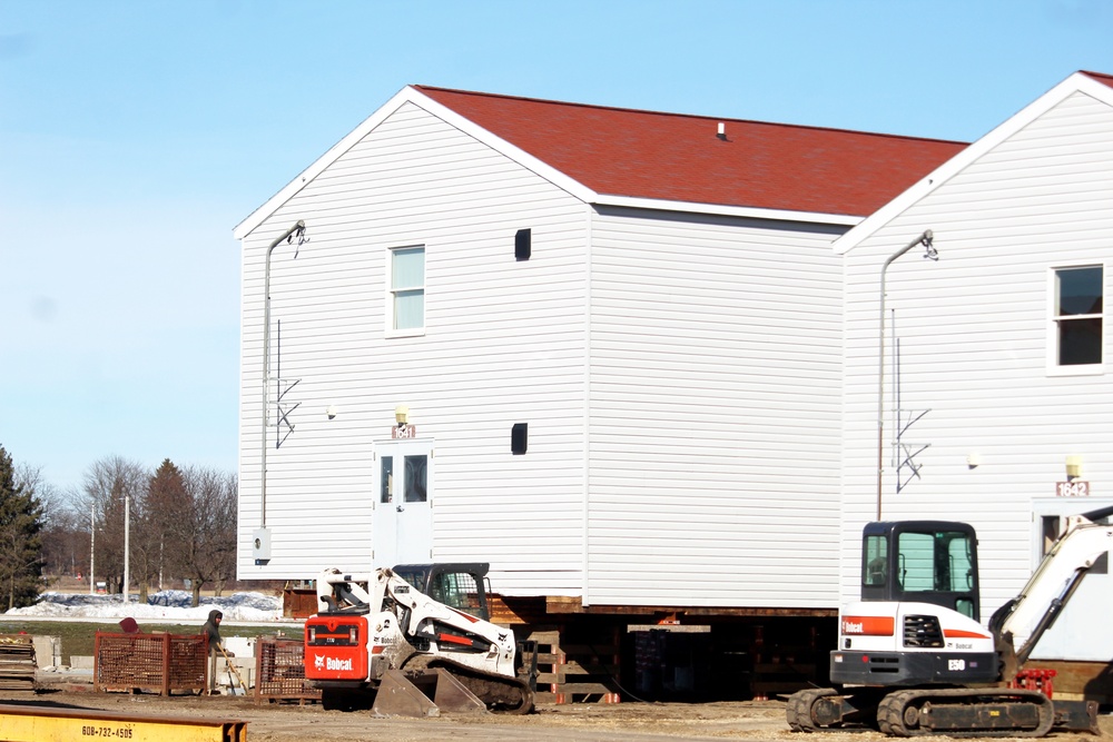 Contractors prepare World War II-era barracks buildings to be moved at Fort McCoy