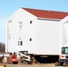 Contractors prepare World War II-era barracks buildings to be moved at Fort McCoy