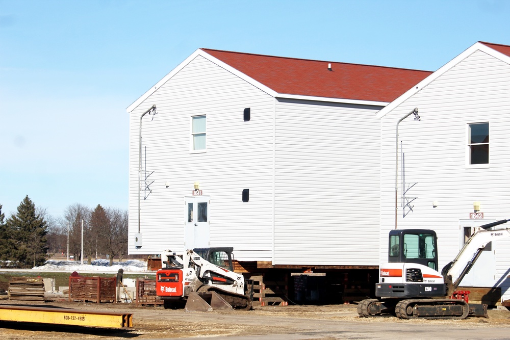 Contractors prepare World War II-era barracks buildings to be moved at Fort McCoy