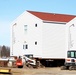 Contractors prepare World War II-era barracks buildings to be moved at Fort McCoy