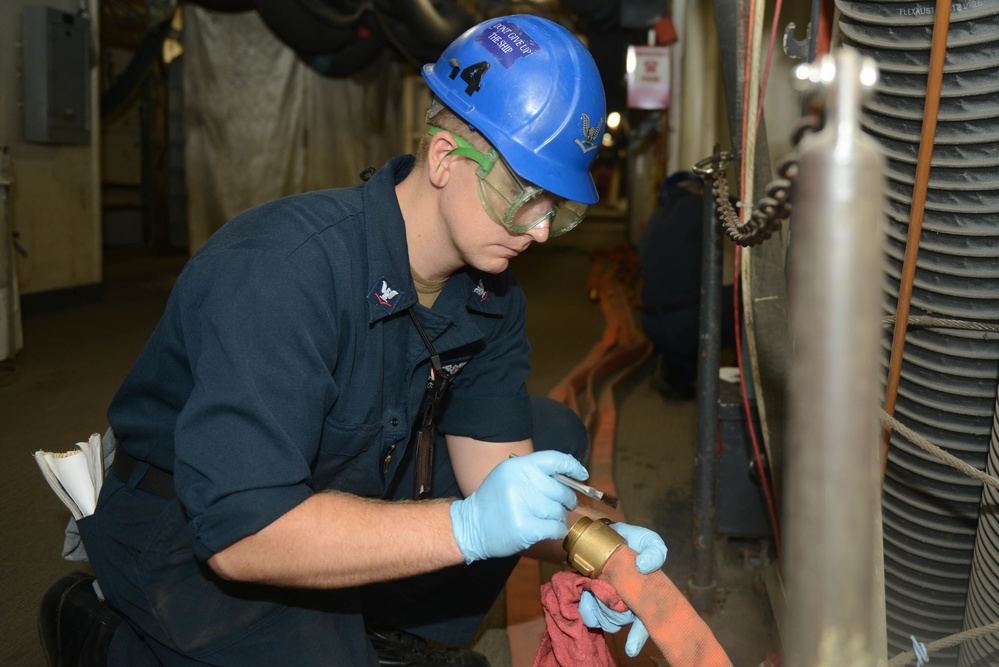 Sailor performs maintenance