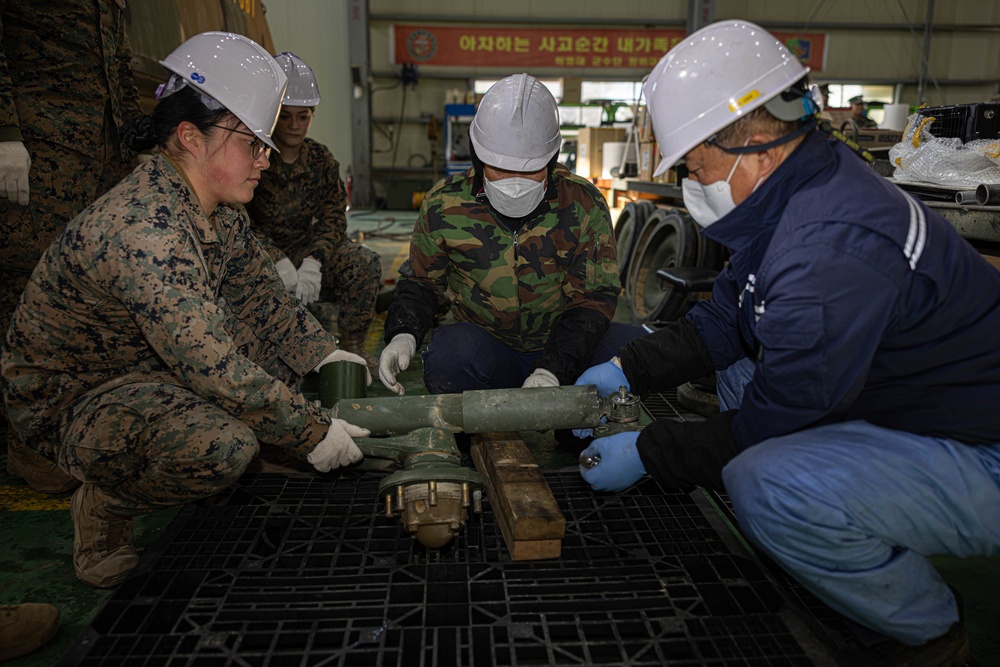 U.S. Marines with 3rd Maintenance Battalion conduct a subject matter expert exchange with Republic of Korea Marines during Korean Marine Exercise Program