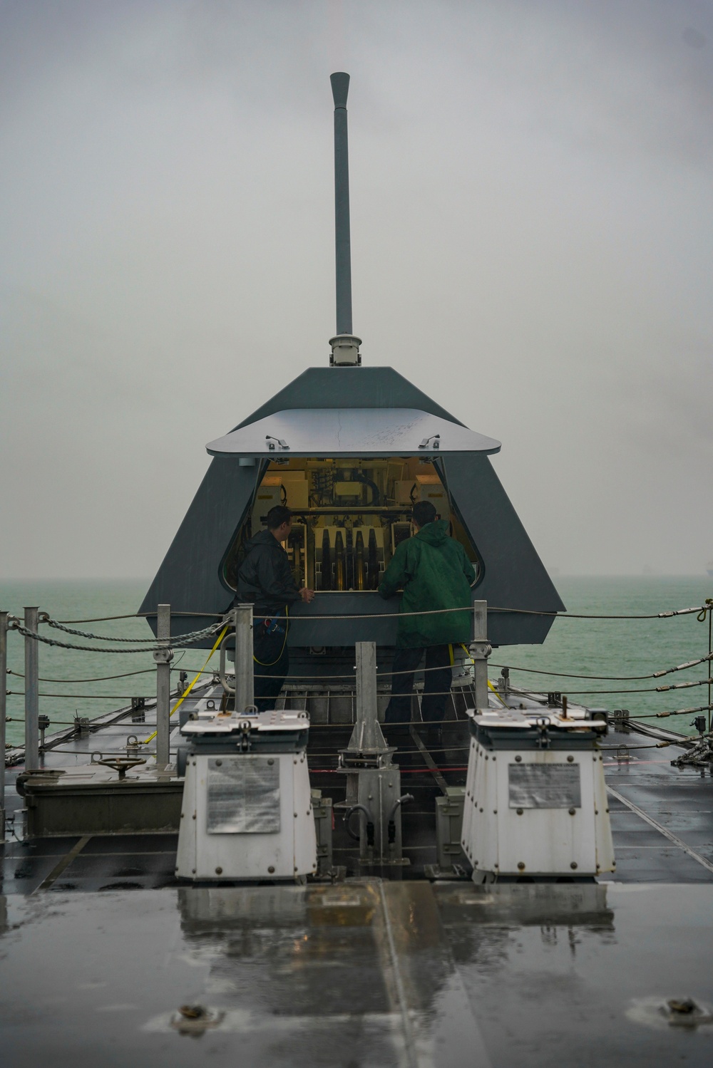 USS Oakland Sailors down-load MK 110 57 mm Gun