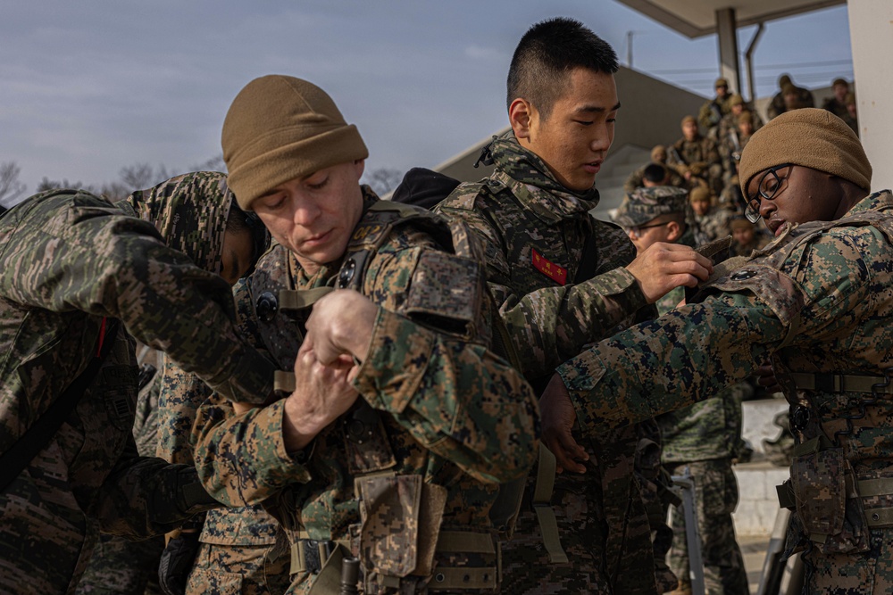 U.S. Marines with 3rd Maintenance Battalion and Republic of Korea Marines with Maintenance Battalion, Marine Logistics Group conduct close quarters combat training during Korean Marine Exercise Program