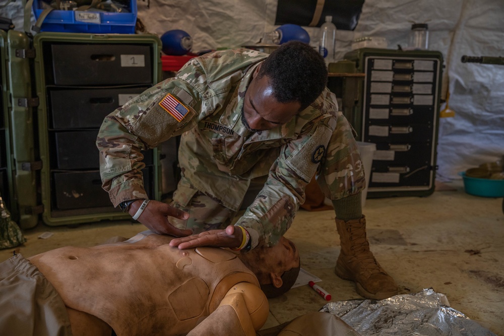 Sgt. Asuerus Thompson checks breathing