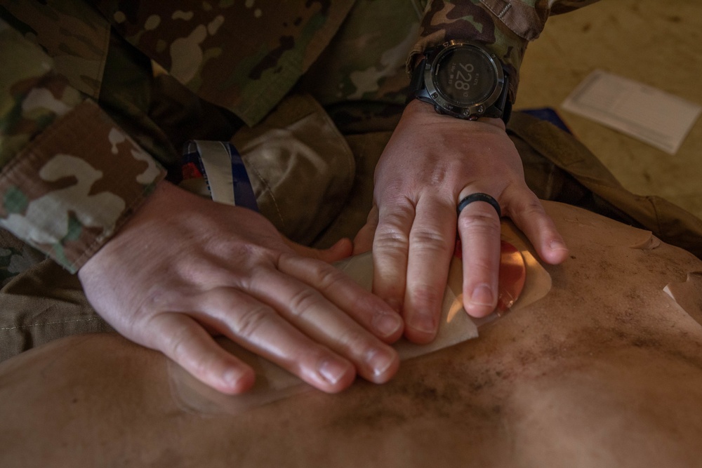 Sgt. Denzel Torres applies a chest seal