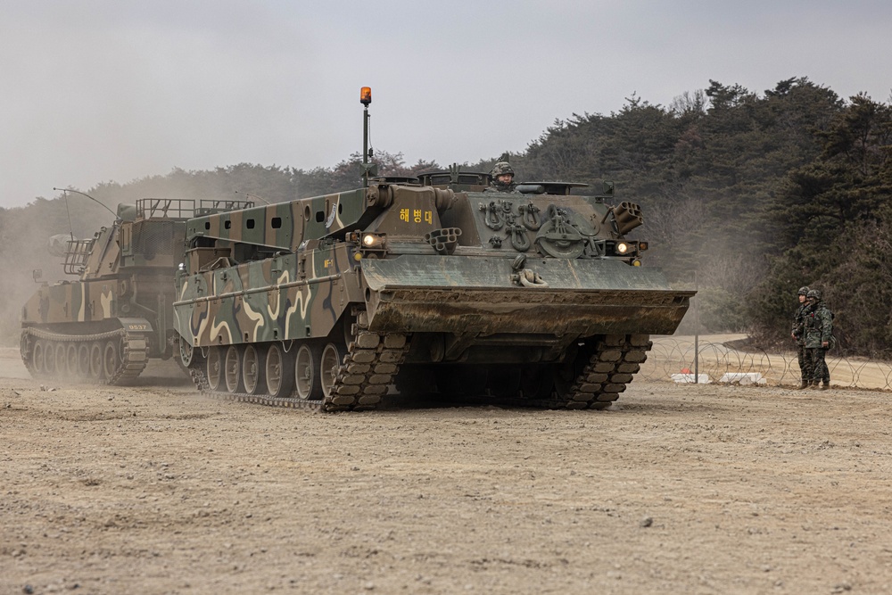 U.S. Marines with 3rd Maintenance Battalion and Republic of Korea Marines participate in vehicle recovery drills and weapon disassembly and assembly contest during Korean Marine Exercise Program