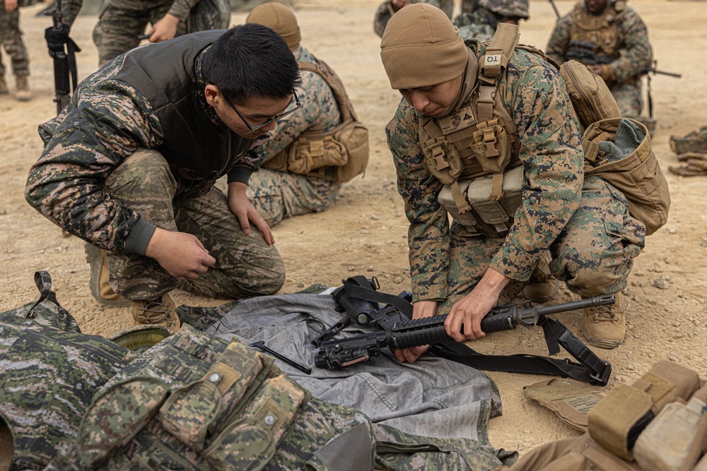 U.S. Marines with 3rd Maintenance Battalion and Republic of Korea Marines participate in vehicle recovery drills and weapon disassembly and assembly contest during Korean Marine Exercise Program