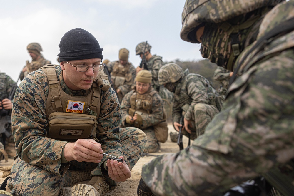 U.S. Marines with 3rd Maintenance Battalion and Republic of Korea Marines participate in vehicle recovery drills and weapon disassembly and assembly contest during Korean Marine Exercise Program