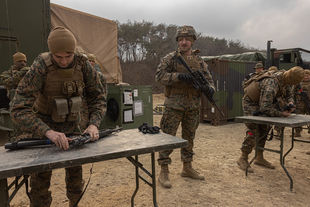 U.S. Marines with 3rd Maintenance Battalion and Republic of Korea Marines participate in vehicle recovery drills and weapon disassembly and assembly contest during Korean Marine Exercise Program