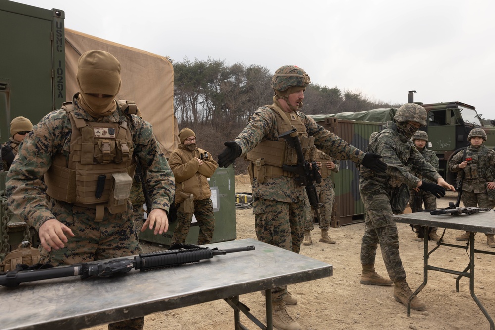 U.S. Marines with 3rd Maintenance Battalion and Republic of Korea Marines participate in vehicle recovery drills and weapon disassembly and assembly contest during Korean Marine Exercise Program