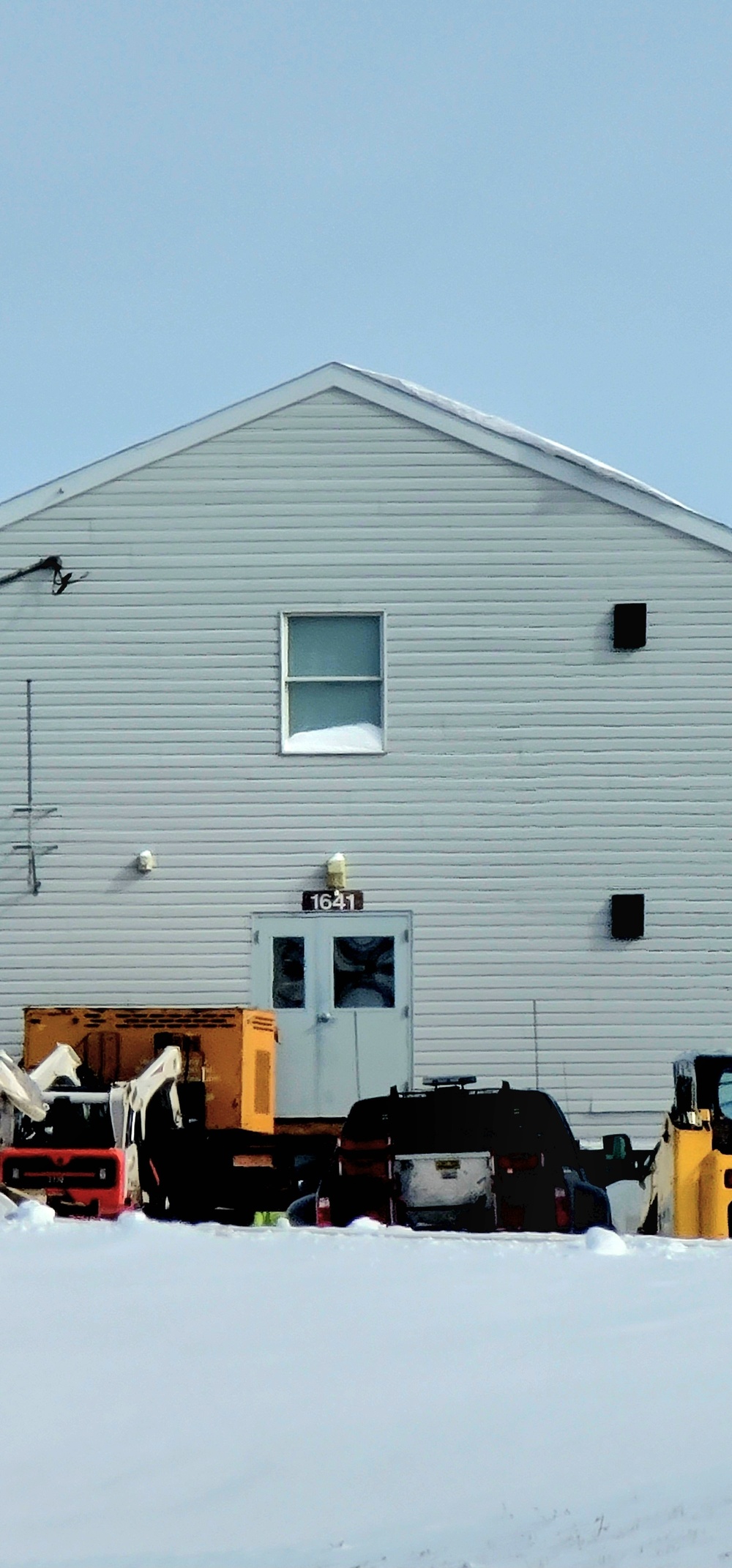 Contractors prepare World War II-era barracks buildings to be moved at Fort McCoy