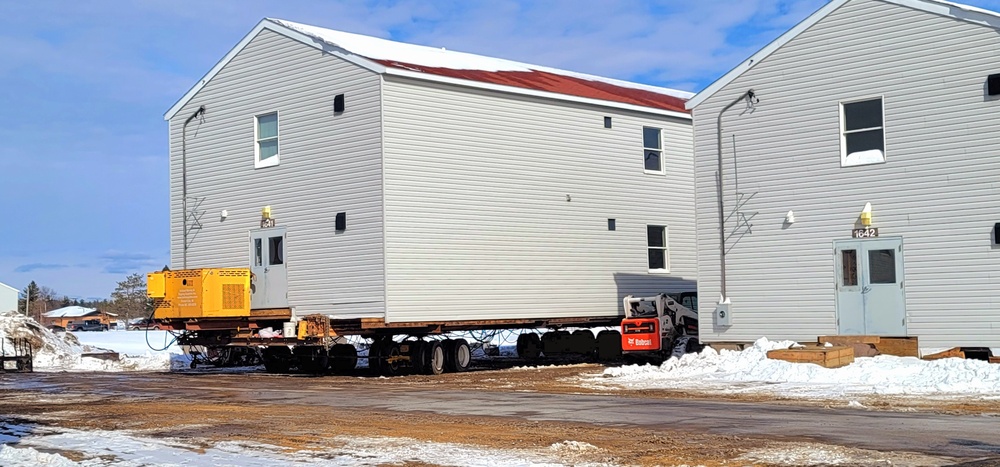 Contractors prepare World War II-era barracks buildings to be moved at Fort McCoy