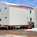 Contractors prepare World War II-era barracks buildings to be moved at Fort McCoy