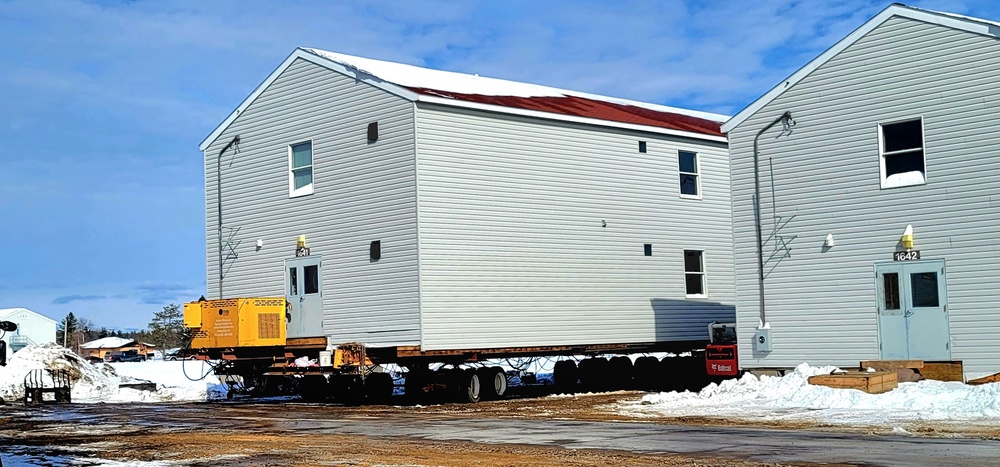 Contractors prepare World War II-era barracks buildings to be moved at Fort McCoy