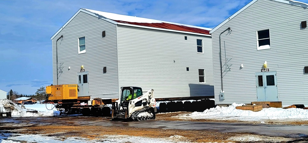 Contractors prepare World War II-era barracks buildings to be moved at Fort McCoy