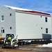 Contractors prepare World War II-era barracks buildings to be moved at Fort McCoy