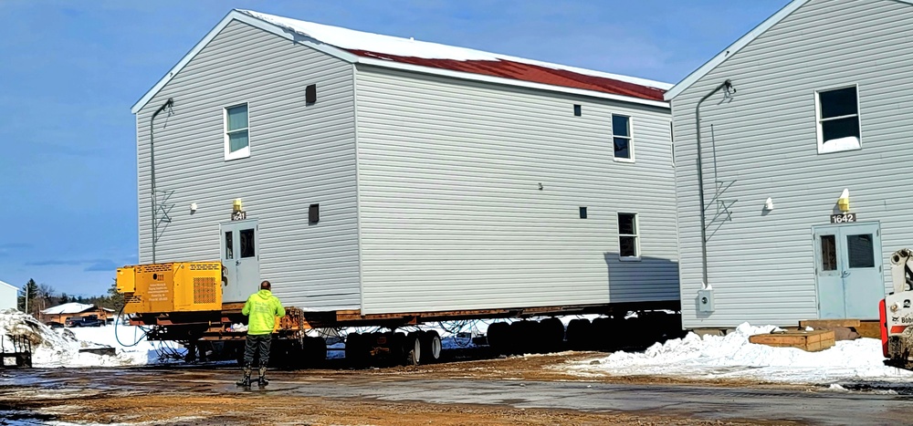 Contractors prepare World War II-era barracks buildings to be moved at Fort McCoy