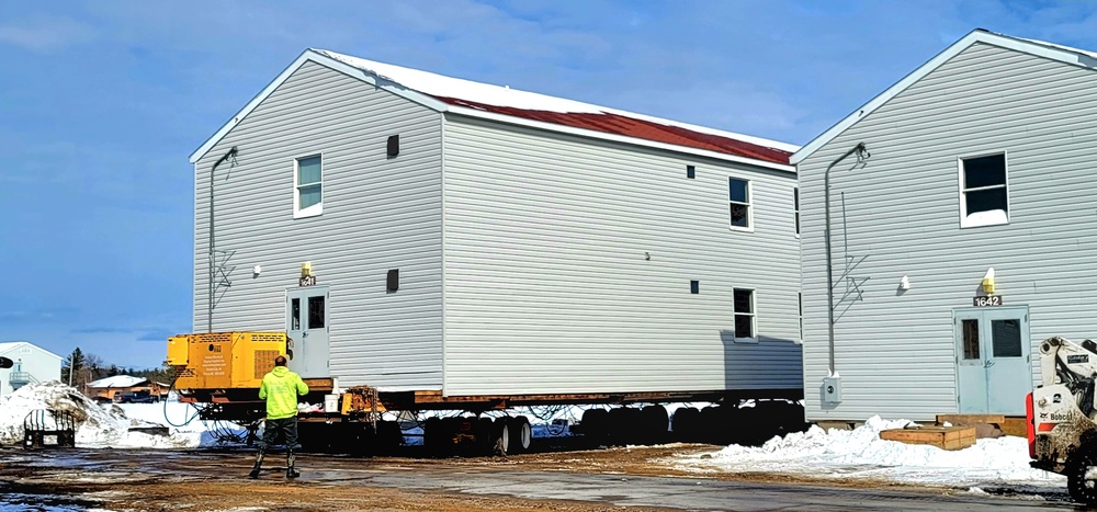 Contractors prepare World War II-era barracks buildings to be moved at Fort McCoy