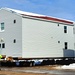 Contractors prepare World War II-era barracks buildings to be moved at Fort McCoy