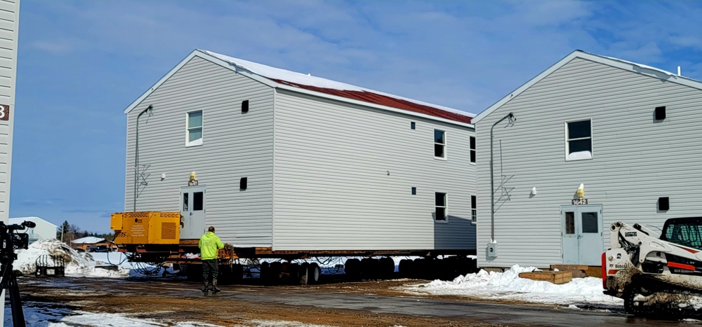 Contractors prepare World War II-era barracks buildings to be moved at Fort McCoy