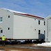 Contractors prepare World War II-era barracks buildings to be moved at Fort McCoy