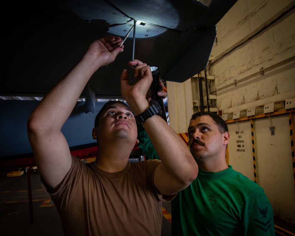 Sailors Perform Routine Maintenance On Aircraft