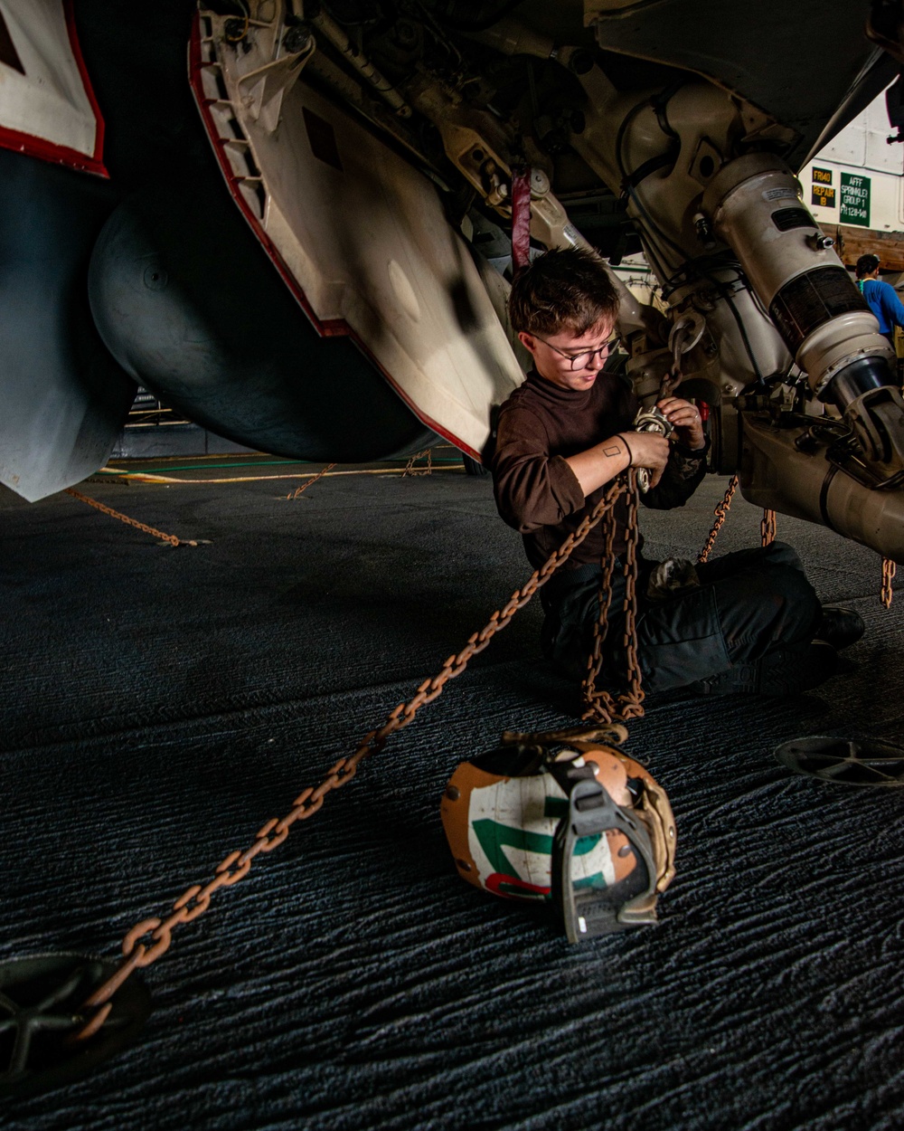 Sailor Ties Down Aircraft