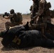 Austrian and Ghanaian soldiers conduct an objective raid