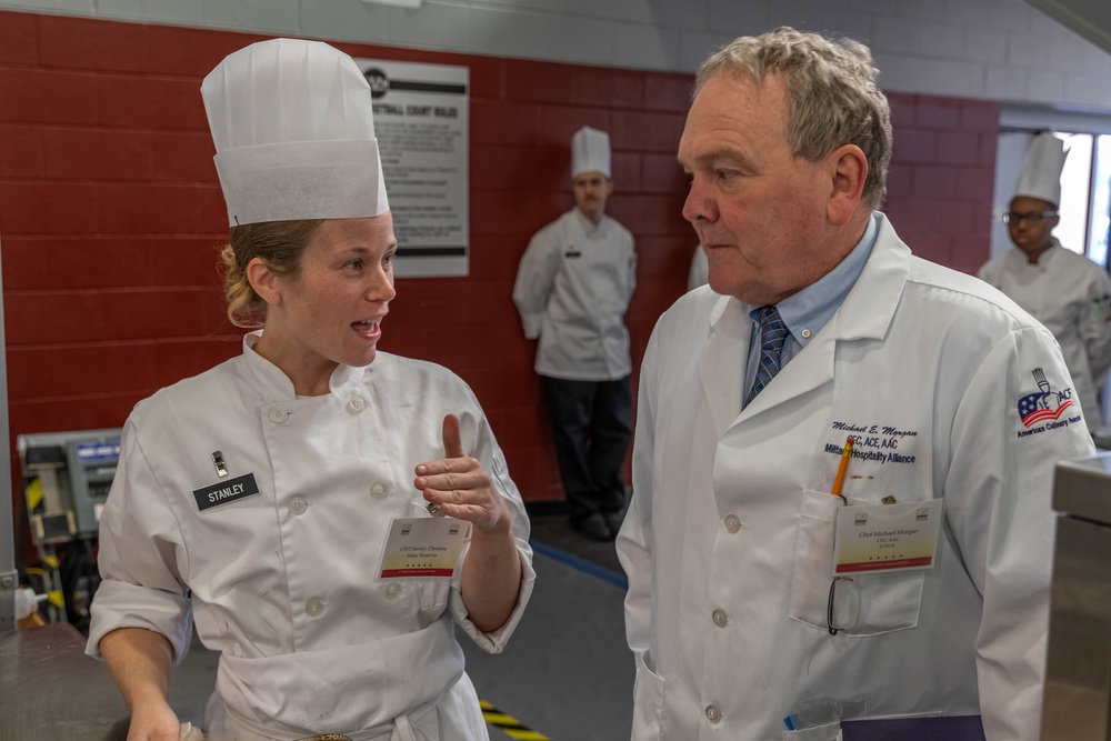 Chief Warrant Officer 2 Christine Stanley speaks with Chef Michael Morgan