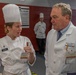 Chief Warrant Officer 2 Christine Stanley speaks with Chef Michael Morgan