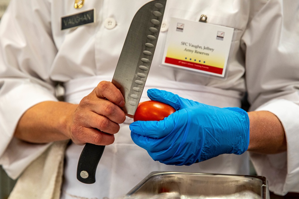 Sgt. 1st Class Jeffery Vaughan cuts a tomato