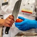 Sgt. 1st Class Jeffery Vaughan cuts a tomato