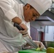 Spc Jacquay Clark slices an apple