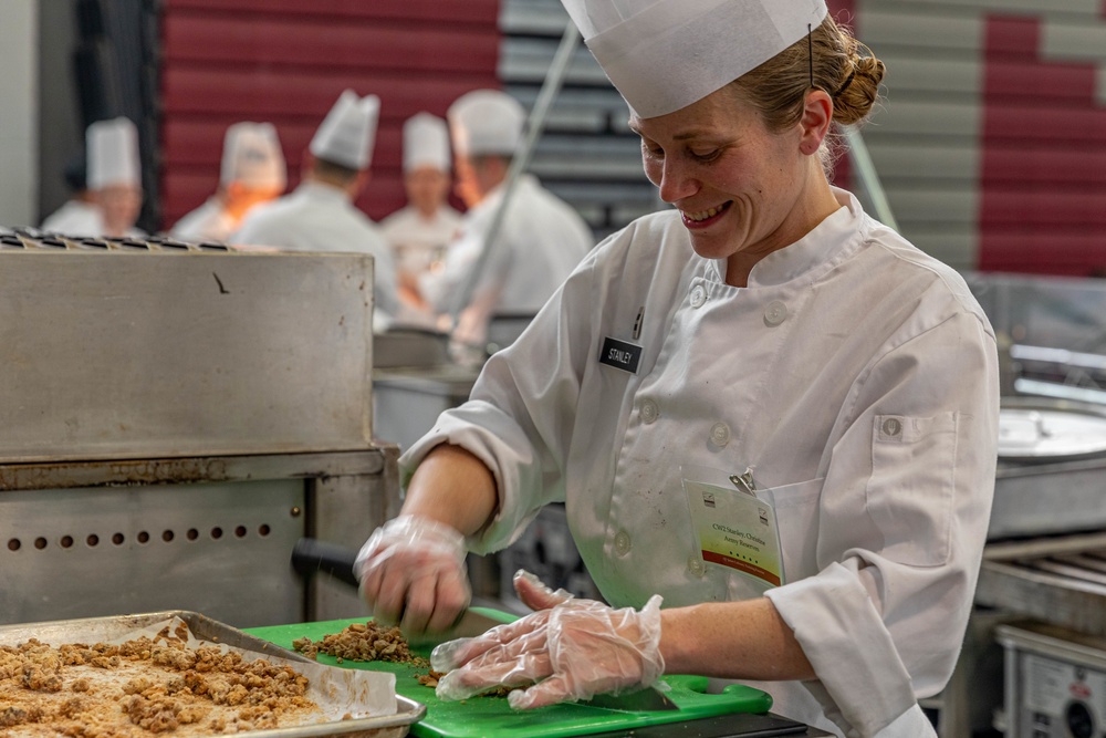 Chief Warrant Officer 2 Christine Stanley chops walnuts