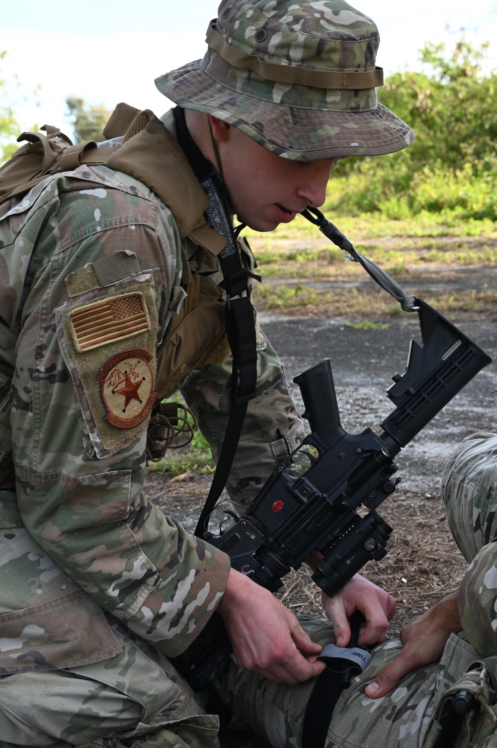 3rd AEW Security Forces personnel practice TCCC during AR 23-1