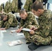 Recruits write letters during holiday routine at Recruit Training Command