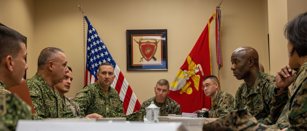 U.S. Marine Corps Col. Reginald J. McClam gives a base tour to the Commandant of the Columbian Marine Corps