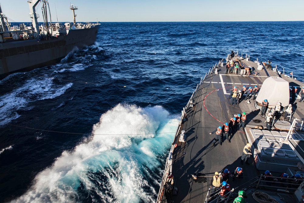 USS MCFAUL CONDUCTS A REPLENISHMENT-AT-SEA