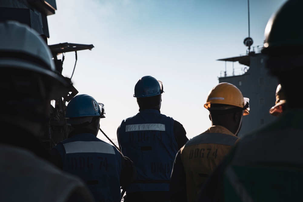 USS MCFAUL CONDUCTS A REPLENISHMENT-AT-SEA