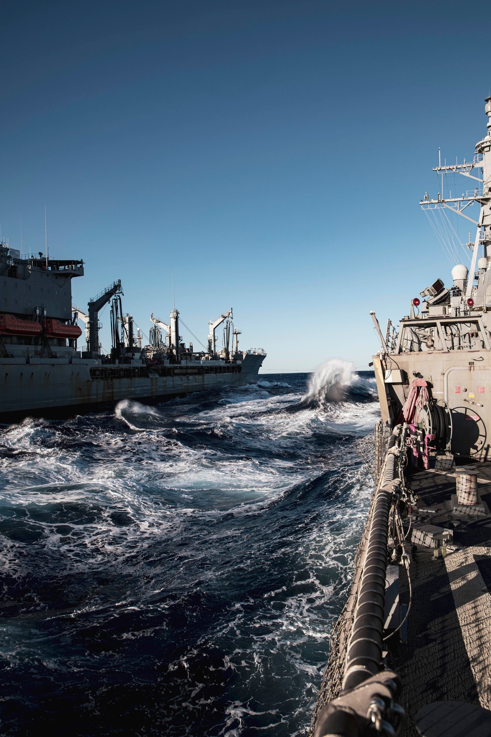 USS MCFAUL CONDUCTS A REPLENISHMENT-AT-SEA