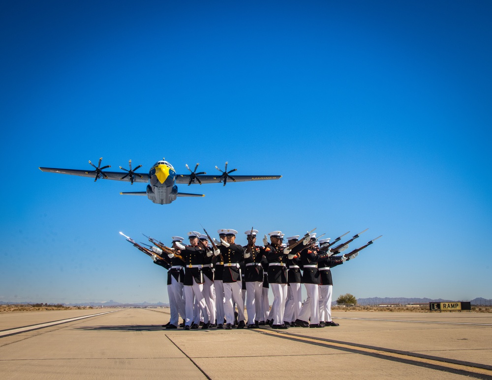 Marines of the Silent Drill Platoon, perform during the Blue Angels’ “Fat Albert” C-130J Super Hercules fly-over at Marine Corps Air Station, Yuma, Ariz.