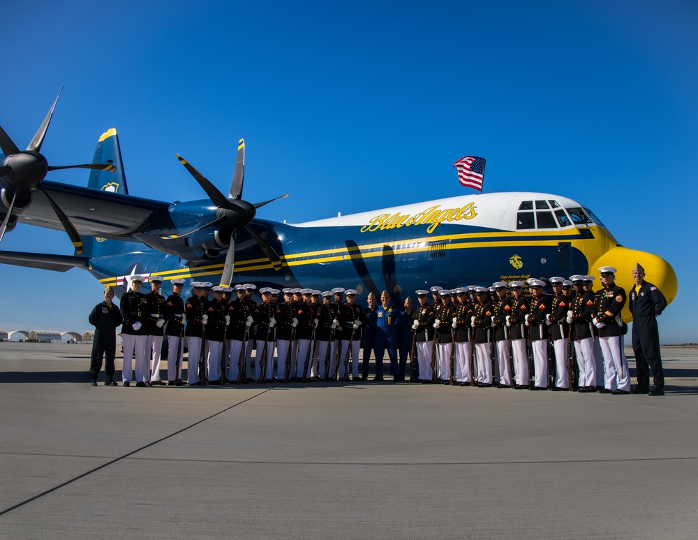 Marines of the Silent Drill Platoon, perform during the Blue Angels’ “Fat Albert” C-130J Super Hercules fly-over at Marine Corps Air Station, Yuma, Ariz.